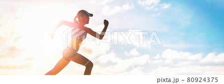 Runner sprinting silhouette training cardio exercise in summer outdoor panoramic banner. Athlete running outside in sunset clouds. Active lifestyle workout fitness lifestyle. Banner panorama 80924375