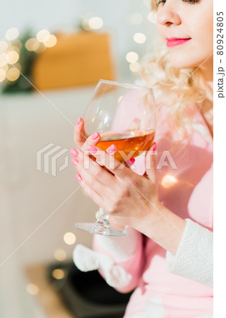 Young housewife preparing christmas dinner in kitchen Young housewife preparing christmas dinner in kitchen 80924805
