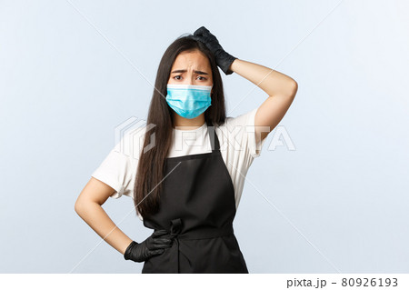 Covid-19, social distancing, small coffee shop business and preventing virus concept. Puzzled indecisive, frowning asian employee dont know what do, scratch head troubled, wear mask and gloves Covid-19, social distancing, small coffee shop business and preventing virus concept. Puzzled indecisive, frowning asian employee dont know what do, scratch head troubled, wear mask and gloves 80926193