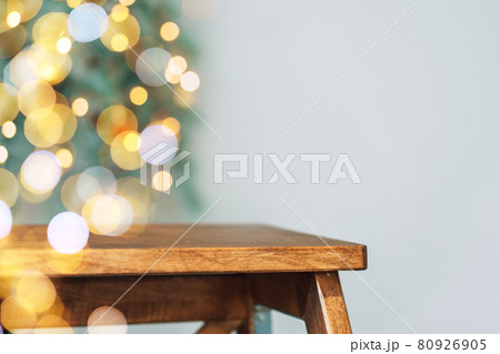 Wooden stepladder against the background of blurry christmas lights Wooden stepladder against the background of blurry christmas lights 80926905