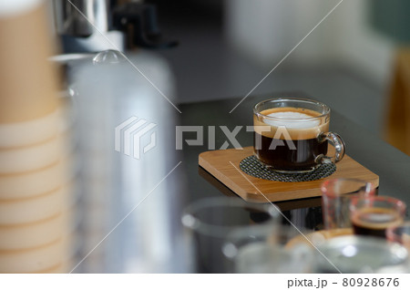 A cup of coffee on the table in the coffee shop A cup of coffee on the table in the coffee shop 80928676