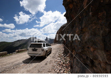 Driving off road car on high altitude mountain top 80930593