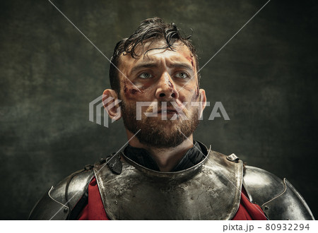 Portrait of one brutal bearded man, medeival warrior or knight with dirty wounded face Portrait of one brutal bearded man, medeival warrior or knight with dirty wounded face 80932294