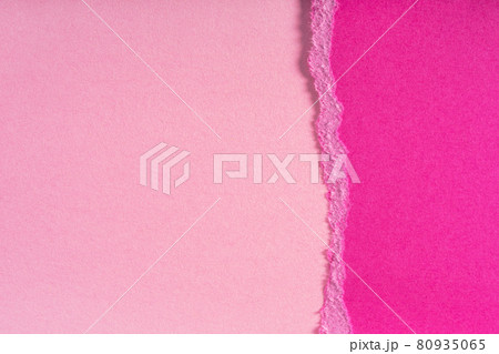 Pieces of torn ragged purple paper edges on pink background. Ripped cracked paper edge isolated with soft shadow. 80935065