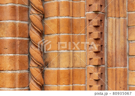 Brick work wall with ornament on old building. Red brick wall texture architecture background. Brick work wall with ornament on old building. Red brick wall texture architecture background. 80935067