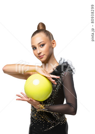 Close-up portrait of young rhythmic gymnastics artist in stage costume isolated on white studio background. Concept of sport, action, active lifestyle 80938299