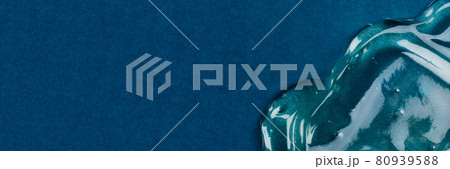 Transparent hyaluronic acid gel on a blue background. 80939588