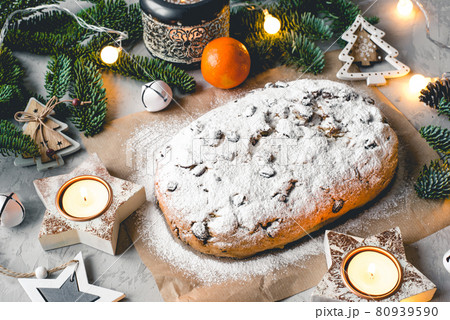 Traditional german stollen cake with Christmas decorations. Traditional german stollen cake with Christmas decorations. 80939590
