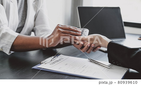 Government officials hand receiving bribe money from business man the concept of corruption and anti bribery Government officials hand receiving bribe money from business man the concept of corruption and anti bribery 80939610