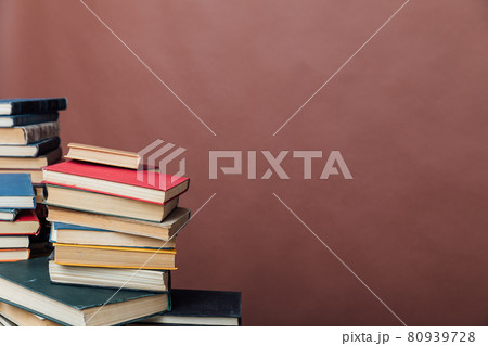 Stacks of books for teaching knowledge university library brown background Stacks of books for teaching knowledge university library brown background 80939728