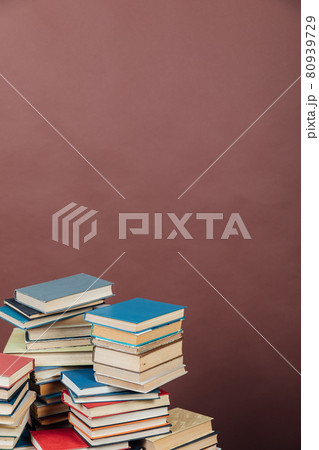 Stacks of books for teaching knowledge university library brown background Stacks of books for teaching knowledge university library brown background 80939729