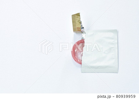 condom out from package prepare to used on white background 80939959