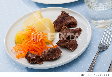 Steamed veal with grated carrot, potatoes 80940445