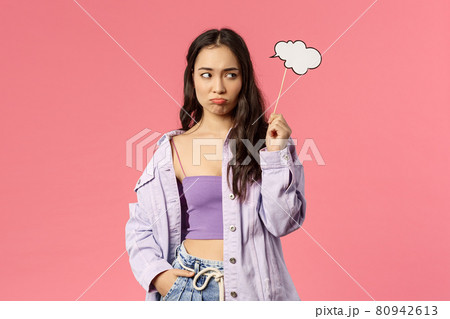 Holidays, lifestyle and people concept. Portrait of gloomy uneasy asian female dont know any idea, sulking and looking away upset of lacking good plan, hold thinking cloud stick nead head Holidays, lifestyle and people concept. Portrait of gloomy uneasy asian female dont know any idea, sulking and looking away upset of lacking good plan, hold thinking cloud stick nead head 80942613