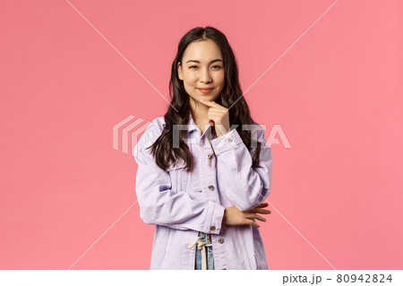Thoughtful and creative, sassy pretty woman have interesting idea, prepared great plan, smile squinting as made-up great thought, scheming, standing pink background 80942824