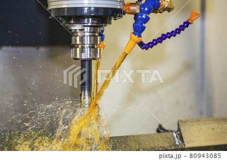 The CNC milling machine cutting the mold parts with oil coolant method. The CNC milling machine cutting the mold parts with oil coolant method. 80943085