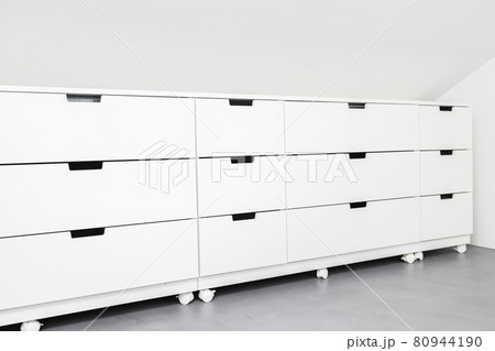 Modern Drawer cabinet with plenty of storage space in a room of a house. Copy space 80944190