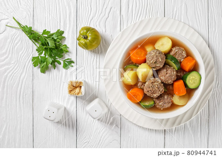 hot mexican meatball vegetable soup, top view 80944741
