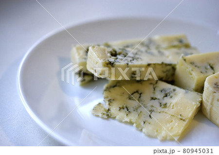 White cheese with blue mold on a plate 80945031