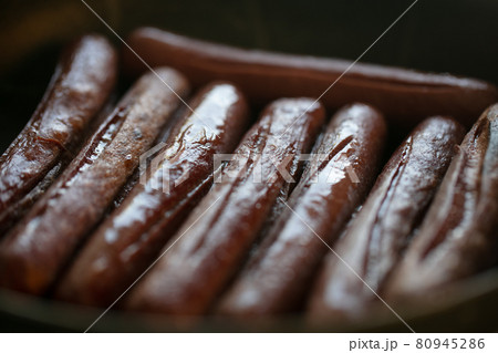 Close-up view of fried sausages. Meat fish. Cooking food Close-up view of fried sausages. Meat fish. Cooking food 80945286