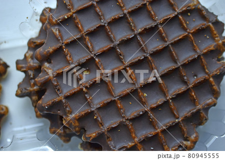 Chocolate round waffle cookies on a white background Chocolate round waffle cookies on a white background 80945555