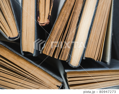 Stack of vintage books lying on the table Stack of vintage books lying on the table 80947273