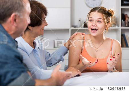 Happy family is talking about life at the table 80948953