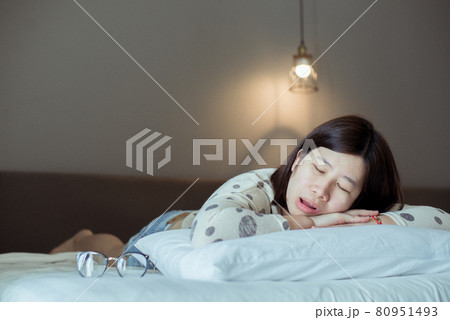 Asian women snoring because due to tired,Female snor while sleeping open your mouth in bedroom 80951493