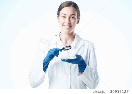 cheerful woman laboratory assistant in a white coat research science diagnostics 80952127