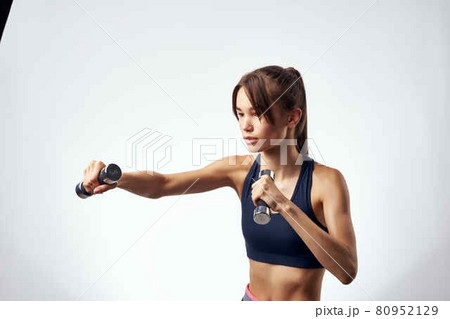 woman exercising with dumbbells strength exercise fitness traffic light 80952129