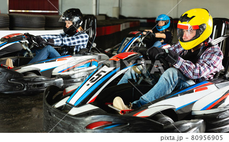 Young people driving sport cars for karting 80956905