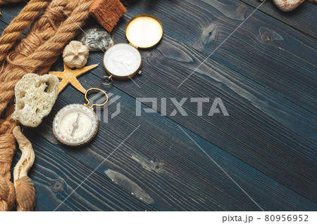 Nautical background. Sailing rope with a compass Nautical background. Sailing rope with a compass 80956952