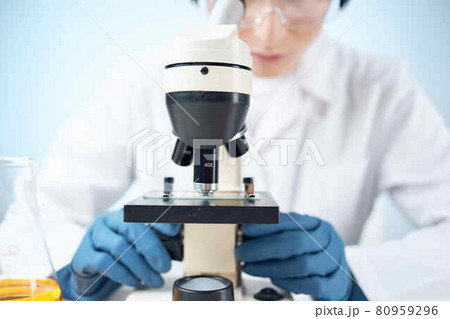 Woman in white coat science research experiment professional 80959296
