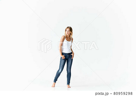 woman in white t-shirt and jeans design isolated background 80959298