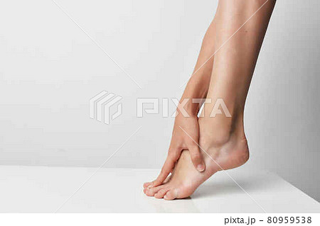 female leg massage joint pain injury close-up female leg massage joint pain injury close-up 80959538