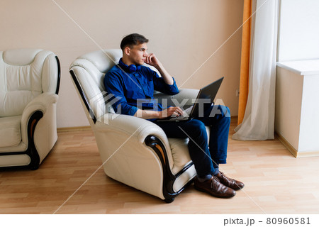 Businessman dressed in shirt having video call on computer in the home office, isolation 80960581