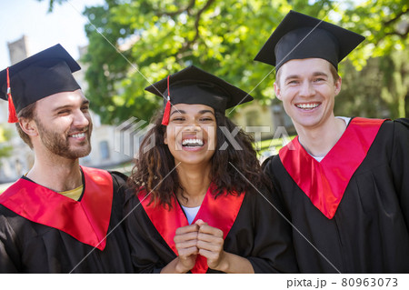 A group of graduates looking happy and excited 80963073