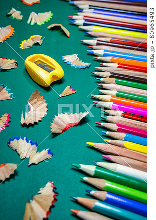 Colorful pencils over green chalkboard Colorful pencils over green chalkboard 80965493