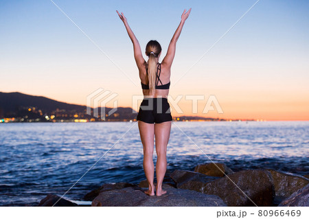 Adult woman is practicing stretching 80966469
