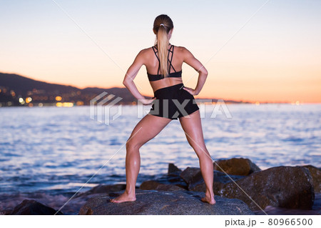 Female 24-31 years old is practicing stretching 80966500