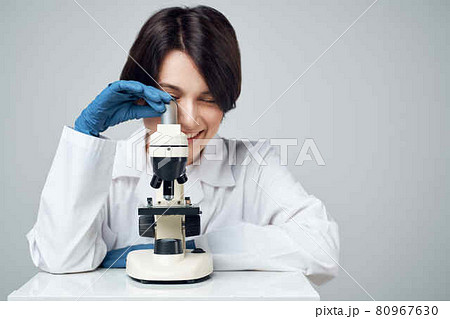 woman scientist laboratory science research microscope 80967630