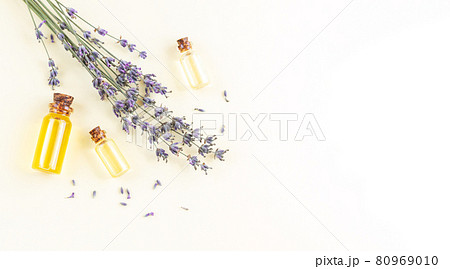 Banner of lavender essential oil bottles or perfume with flowers 80969010