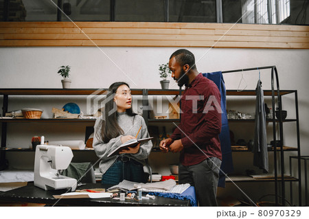 Diverse designers coworkers talking in the workshop 80970329