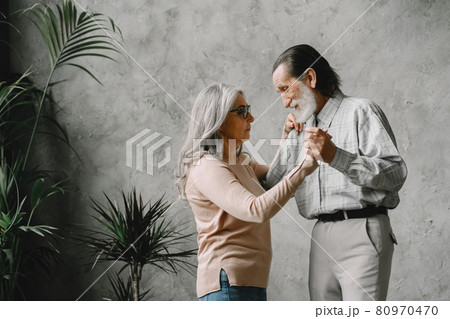 The happy elderly woman and a man dancing 80970470