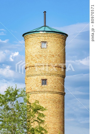 Water tower of artesian well. Outdoors, day light front view. 80970571