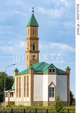 Mosque against a beautiful sky. Outdoors, day light front view. 80970708