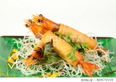 Close up fried Shrimps wrapped roll and crispy noodles as appetizer on white background 80973559
