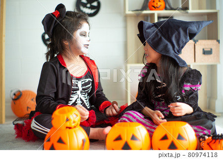 Portrait pair of little girls in Halloween and carnival costume isolated on white background Portrait pair of little girls in Halloween and carnival costume isolated on white background 80974118