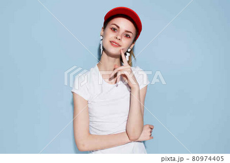 cheerful young woman in red cap fashion summer style Glamor studio cheerful young woman in red cap fashion summer style Glamor studio 80974405