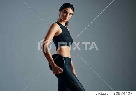 athletic woman shakes muscles slim figure workout motivation athletic woman shakes muscles slim figure workout motivation 80974407